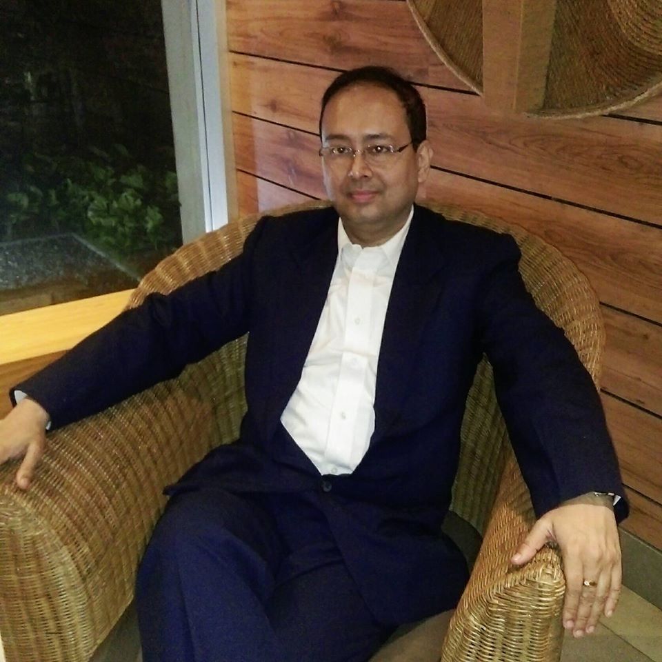 Dr. Souparno Bose seated in a clinic setting